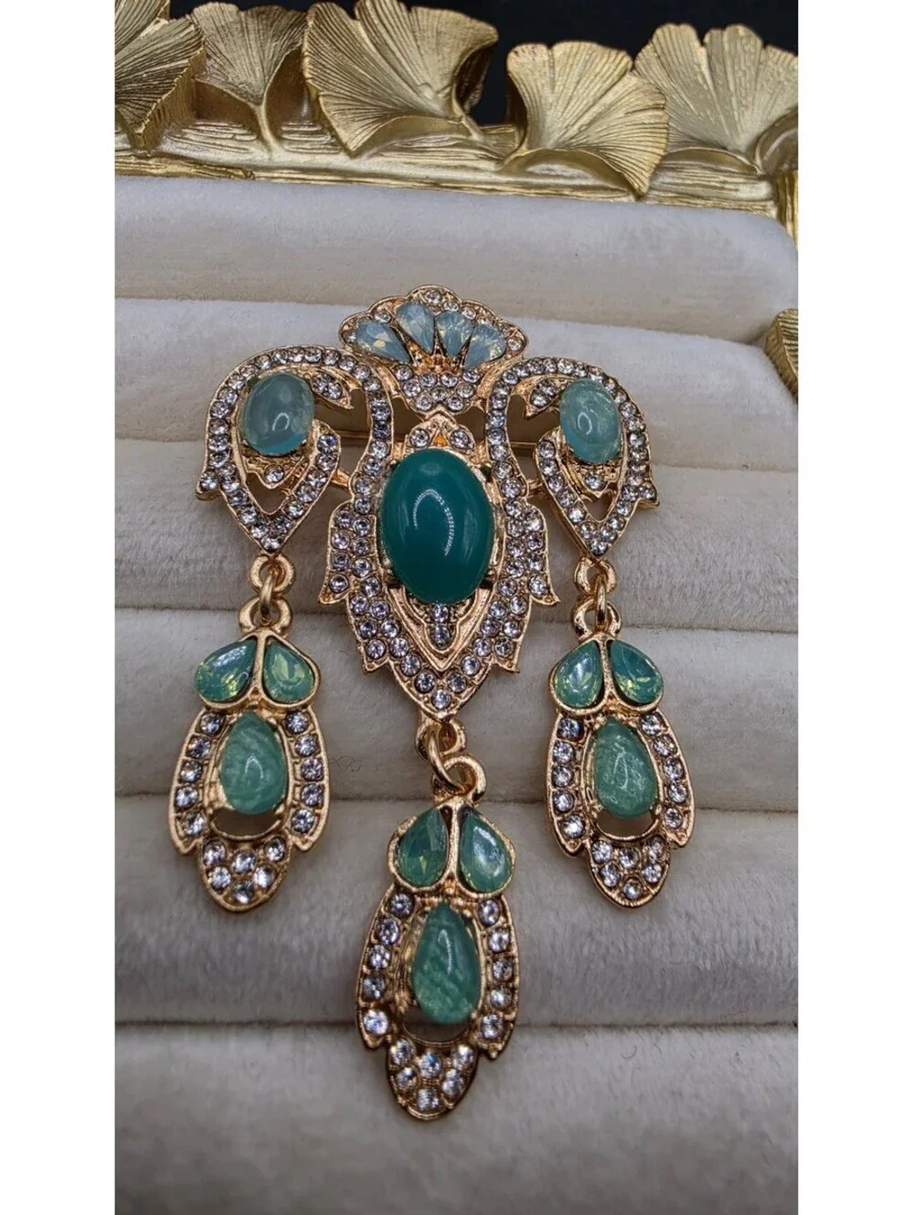 Vintage-Inspired Teal Gemstone Brooch with Dangling Design